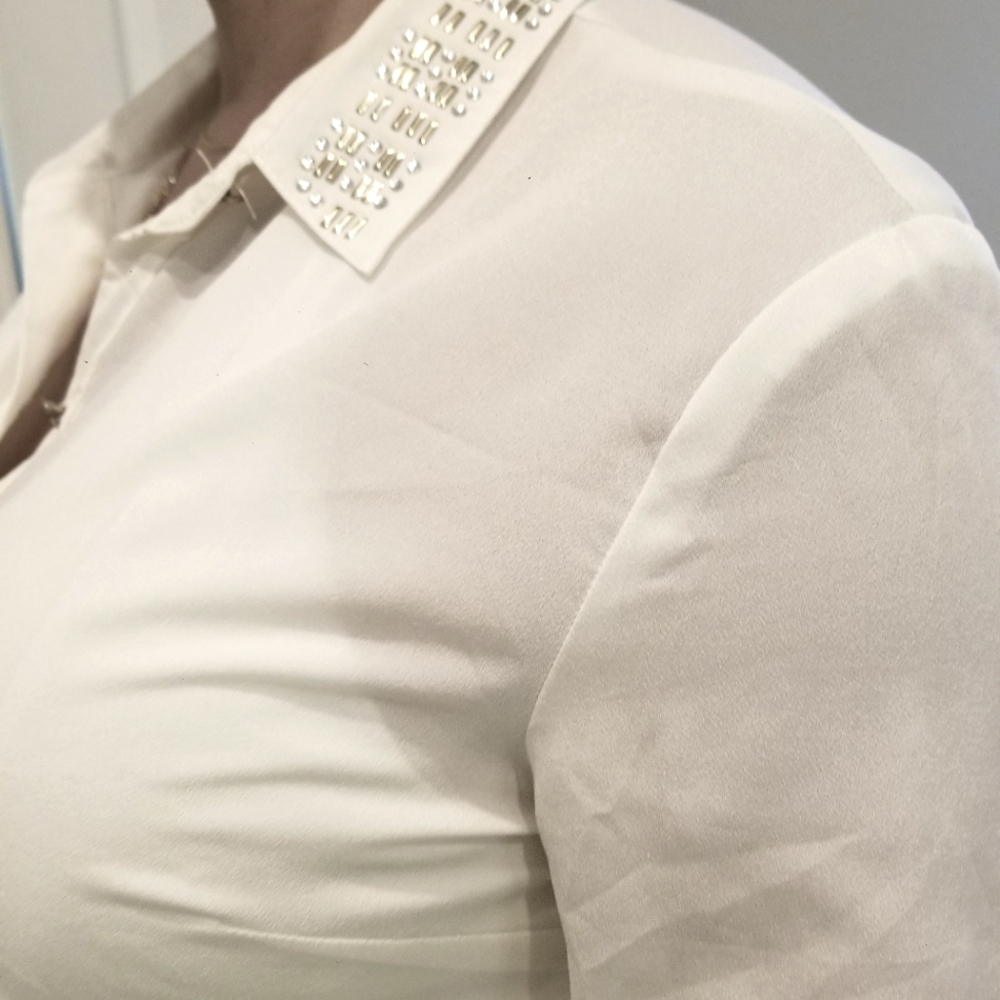 Sheer collard shirt with metallic embellishments.